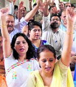 Teachers hold a protest at Government PG College in Karnal on Tuesday.