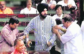 A TV grab shows BJP MP Navjot Singh Sidhu in the Lok Sabha during the ongoing monsoon session of Parliament in New Delhi on Tuesday.