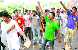 SOI supporters raise slogans during campaigning