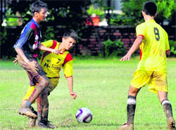 Players of Mohun Bagan Academy and NPS Academy vie for the ball during a match in Chandigarh on Wednesday