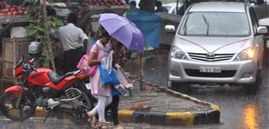 Girls caught in the rain in New Delhi 