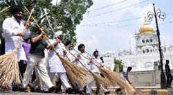 SAD (UK) activists participate in a Delhi cleanliness drive around the Commonwealth Games Delhi 2010 Organising Committee Headquarters in New Delhi 