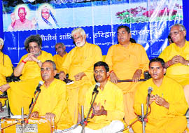 Volunteers of the Shanti Kunj perform before the commencement of the training camp in Haridwar on Wednesday.