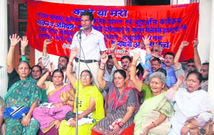 Statehood agitators hold a meeting on the 16th anniversary of the Khatima police firing at Shaheed Sthal in Dehradun on Wednesday.