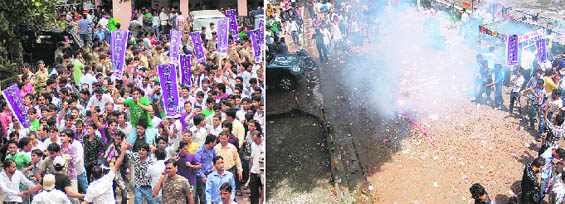 An election rally in progress at DAV College in Dehradun on Wednesday; (right) Crackers being burst in DAV College during an election rally in Dehradun on Wednesday.