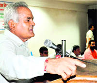 State Social Welfare Minister Matbar Singh Kandari speaks at the Town Hall in Haridwar on Wednesday