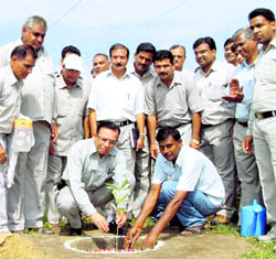 BHEL Managing Director Devendra Kumar Modi plants a sapling at Ranipur in Haridwar on Wednesday