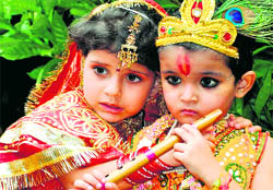 Two children dressed as Radha and Krishna