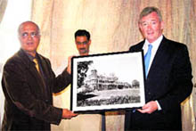 Middlesex University VC Michael Driscoll (R) gives the photograph of Viceregal Lodge building to Director of the Indian Institute of Advanced Studies Dr Peter Ronald dSouza in Shimla on Wednesday. 