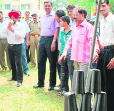 IG, CRPF, AS Sidhu takes an aim during a fair organised on the occasion of the 42nd Raising Day of CRPFs Group Centre in Ban Talab in Jammu on Wednesday.