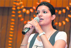 A participant takes part in a singing competition Surtarang in Ludhiana on Wednesday.