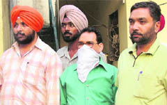 The accused in Vigilance Bureau custody on Wednesday.