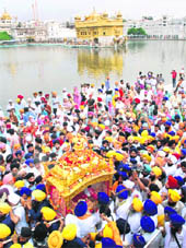 A view of the nagar kirtan procession on the Parkarma of the Golden Temple on Wednesday.
