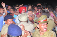 The police tries to rein in SOPU and PUSU supporters on the PU campus at Chandigarh on Thursday night. 