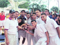 Shivaji section with the winners trophy at the RIMC inter-section swimming competition in Dehradun on Thursday.
