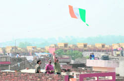 A youth flies a kite in Jammu on Janmashtami on Thursday. 