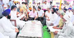 Punjab Chief Minister Parkash Singh Badal interacts with panchayats during Sangat Darshan at Mamujoyia village in Ferozepur 