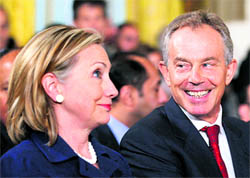 US Secretary of State Hillary Clinton chats with former British Prime Minister Tony Blair at the White House in Washington.