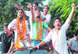 Sehajpal Singh (left) with has supporters in DAV College, Sector 10.