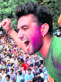 A supporter cheers PUSU victory in Chandigarh on Friday.