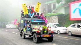 Students create pandemonium on the streets of Mussooorie after filing nomination at the MPG College.