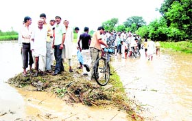 Villagers stranded as rain water engulfs low-lying areas in Pathri village.