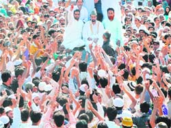 Chairman of the moderate faction of the Hurriyat Conference Mirwaiz Umar Farooq leads a rally in Srinagar