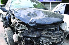 The mangled Indica car that ran over a man in New Delhi.