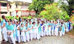 Students line up to vote in the students council elections at MKP Girls College in Dehradun