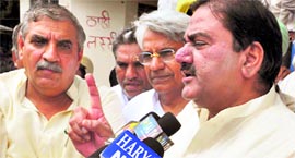 Torn shirt while INLD Ellenabad MLA Abhey Chautala addresses the media in Kurukshetra on Saturday.