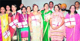 UT schoolteachers after receiving state awards on the Teacher’s Day at Tagore Theatre in Chandigarh