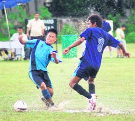 A rain soaked match in progress at the All-India Inter School Soccer Tournament at RIMC in Dehradun