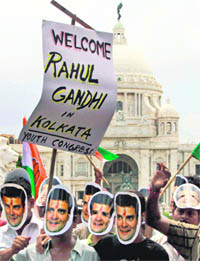 Youth Congress activists wear the masks of Congress general secretary Rahul Gandhi to welcome him in Kolkata on Sunday
