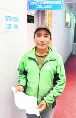 Sonam Gyalisan, a flash floods-affected residents awaits outside the Leh Deputy Commissioners office to get compensation against the loss of his house and pony. He travelled for three days to reach Leh from Fotaksar village which has no road connectivity as yet