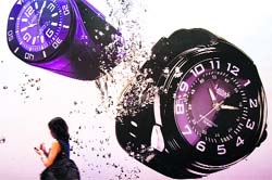 A visitor walks past a booth at the Hong Kong Watch and Clock Fair 2010 in Hong Kong on Monday. The show features over 700 exhibitors from 