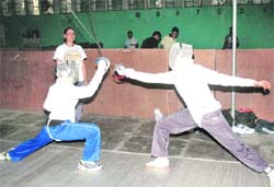 Players practise during a fencing camp at Punjabi University in Patiala 