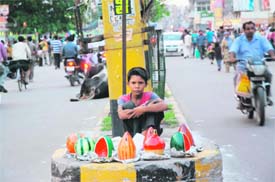 Forced by penury, this child has to sell golaks to make both ends meet.