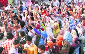 Residents hold a demonstration in the Pattan area in Baramulla district where four persons were killed in clashes with the police