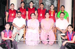 Winners of the weightlifting championship with their medals in Ludhiana.