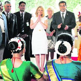 Poland Prime Minister Donald Tusks wife Malgorzata (centre) being welcomed in Bangalore