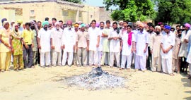 Residents attend the cremation of a four-year-old Dalit boy in Mehma Bhagwana village (Bathinda district) on Monday.