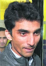 Pakistan cricketer Yasir Hameed leaves the Pakistan High Commission in London. 