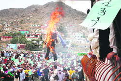 Afghans burn an effigy of Dove World Outreach Center's pastor Terry Jones during a demonstration against the United States in Kabul on Monday. 