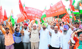 Different trade unions take out a rally at Sector 22 in Chandigarh on Tuesday.