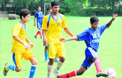 Players in action during a football match at Sector 17, Chandigarh, on Tuesday.