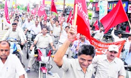 Employees of BHEL and various banks hold a rally at Devpura in Haridwar on Tuesday.