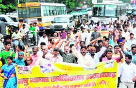Members of the Small Traders Association take out a rally in Haridwar on Tuesday.