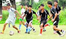 Players vie for the ball at the Senior Council Football Tournament in Dehradun on Tuesday.