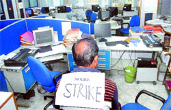 An employee of Life Insurance Corporation participates in the strike organised by various trade unions against price rise and disinvestment in public sector units in Jalandhar on Tuesday