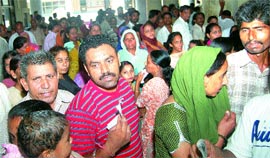 Scores of pateints wait in front of the registration counter of the civil hospital, Jalandhar. They had to wait for hours for their registration slips due to power failure in the hospital on Tuesday morning.